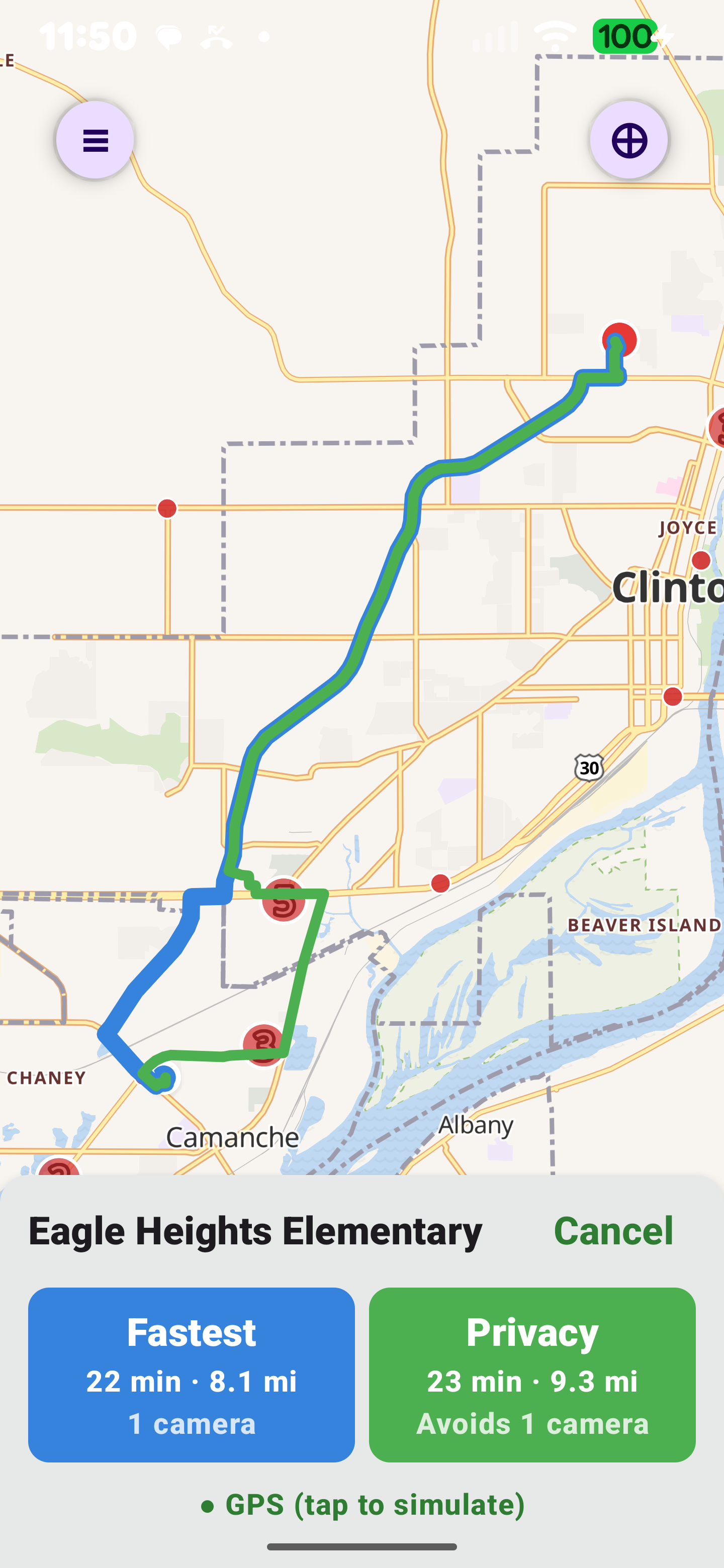 RedactedRoute app showing two routes to Eagle Heights Elementary in Clinton, Iowa: the fastest route at 22 minutes and 8.1 miles passing one ALPR camera, and the privacy route at 23 minutes and 9.3 miles — a clearly diverging detour around the camera for one extra minute. The map shows the two routes as separate loops around the camera cluster, with route cards comparing time, distance, and camera count.
